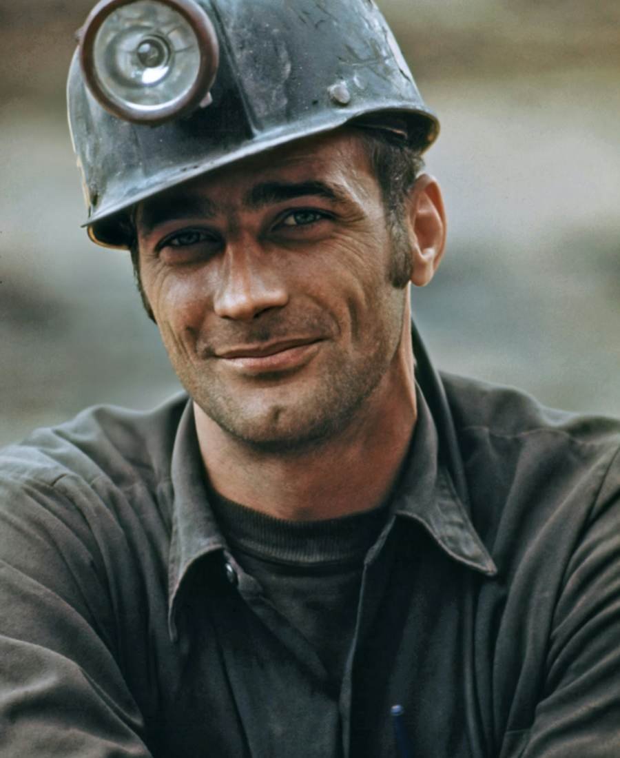 A tradesperson in a work shirt on site